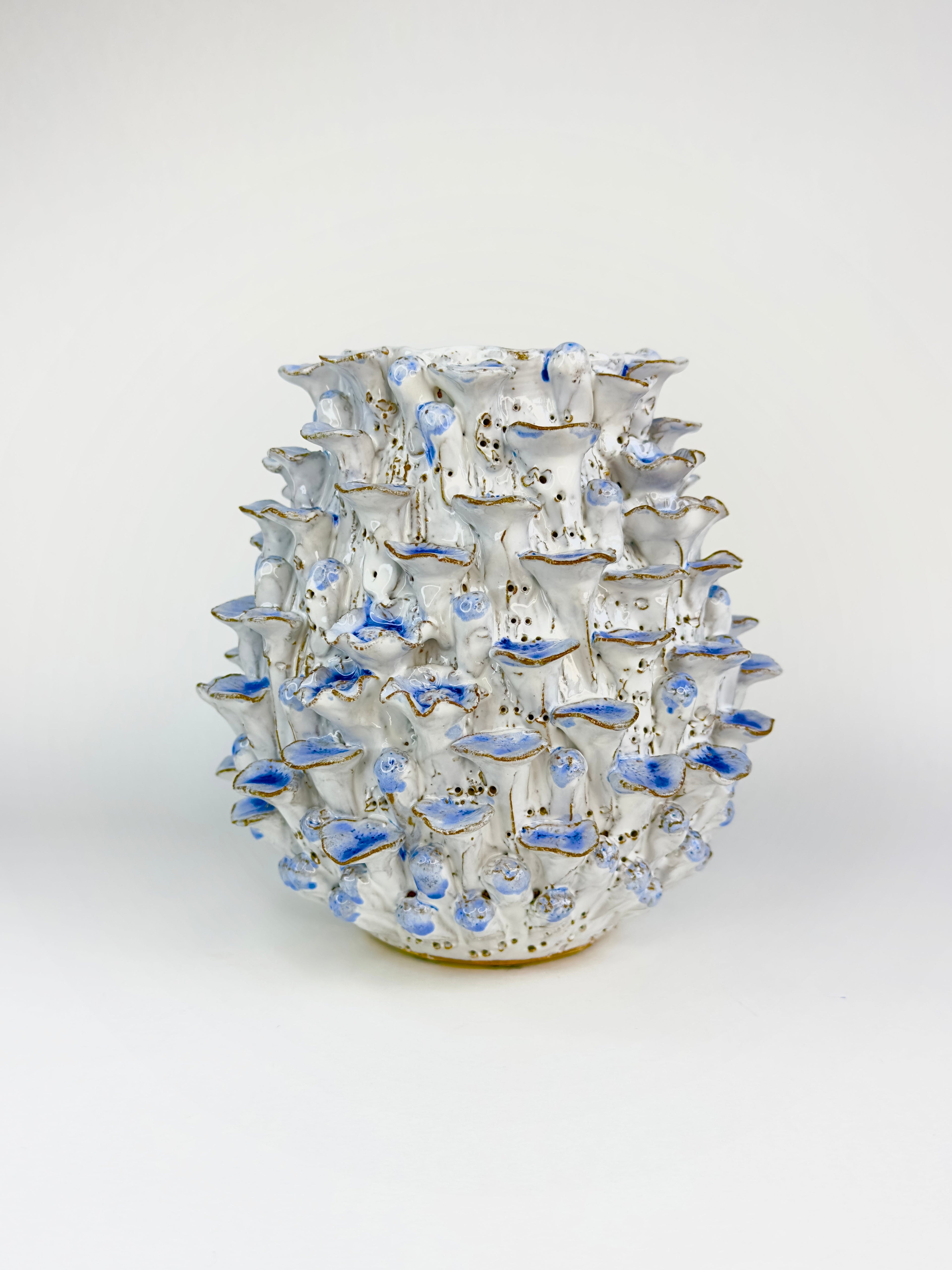 Decorative vase with a unique design on a white background